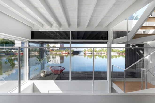 glass walls that open to wood patio