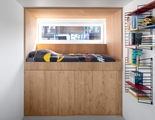 wooden nook with a built-in bed