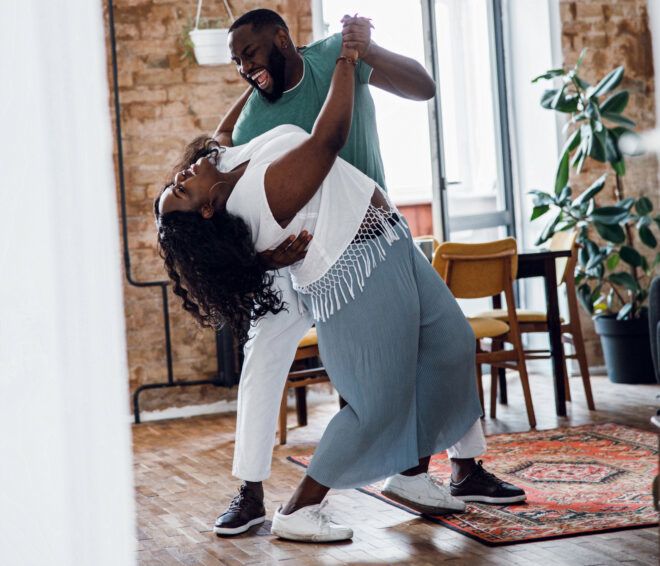 couple dancing in their living room