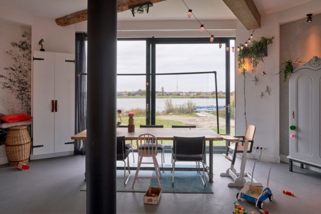 long wood dining table facing large window