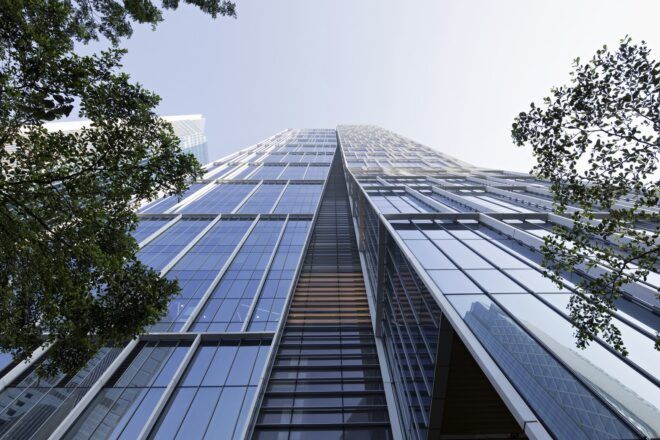 An image looking up at the side of a high-rise tower.