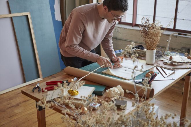 Joseph Alessio working in an art studio.
