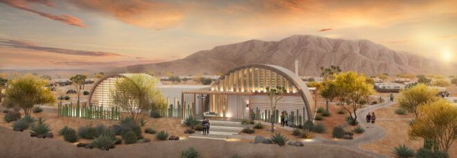 rendering of Airstreams behind rounded buildings surrounded by mountains and desert at sunset