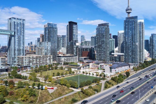 A bird's-eye view of a sprawling green community campus in the city.