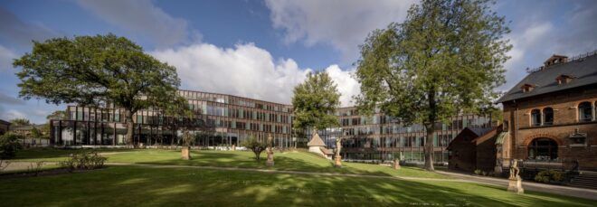 elongated glass and copper building