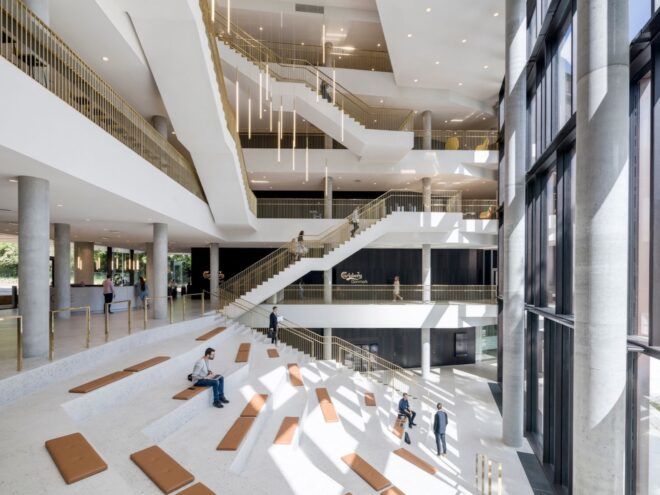 large series of white staircases inside an office building