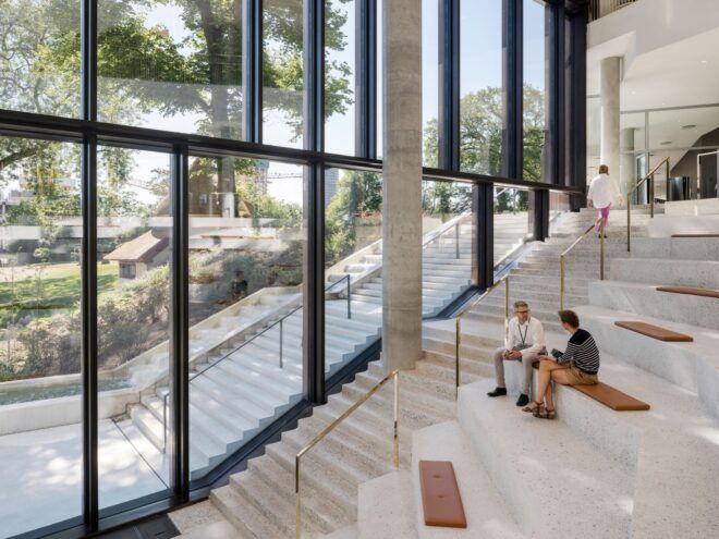 people sitting on steps built into a staircase