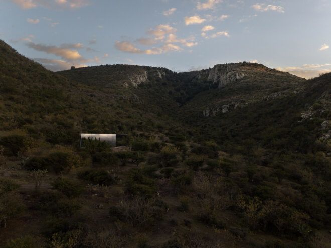 glass cabin on mountainous landscape