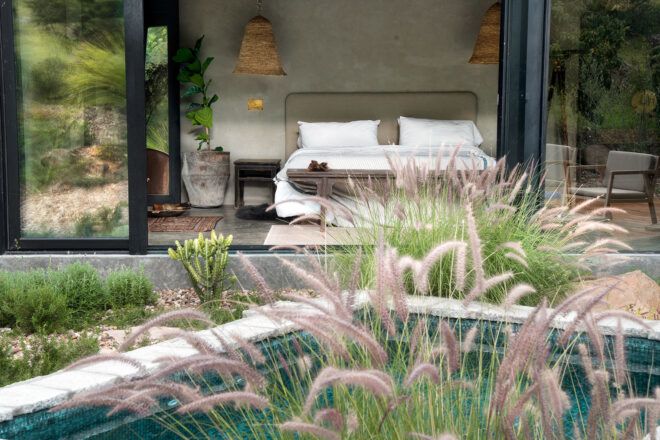 bedroom with sliding glass door open to a patio