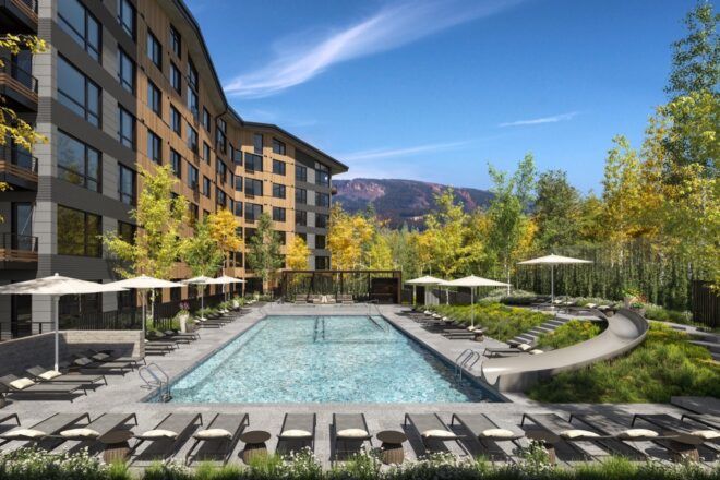 pool outside brown condo building