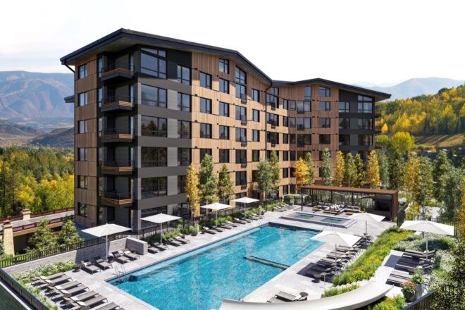 brown and gray condo building with pool