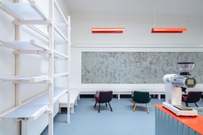 white room with white built-in bench along two walls