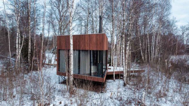 wood cabin in snowy forest