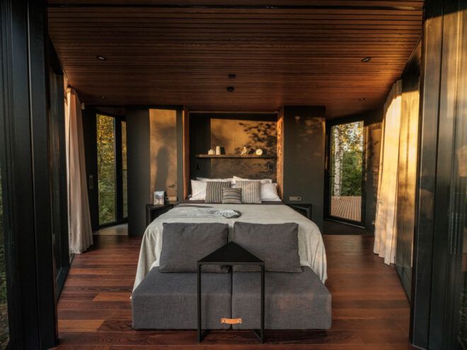 wood room with bed in the center