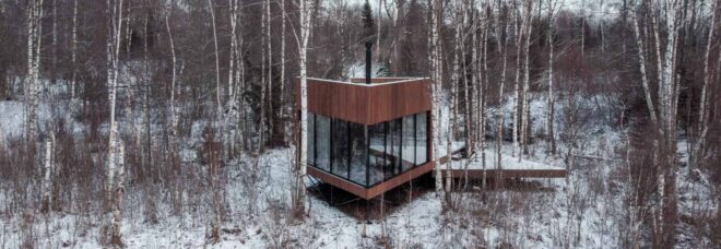 wood cabin in snowy forest