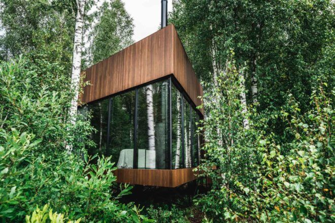 wood cabin in green forest
