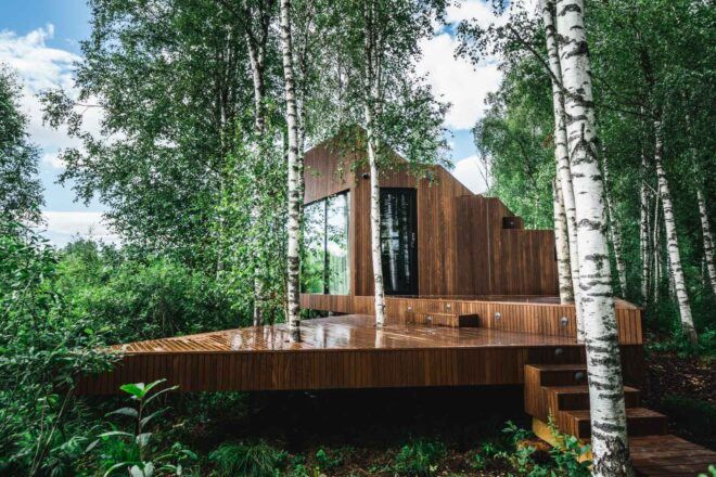 wood cabin with large wood deck