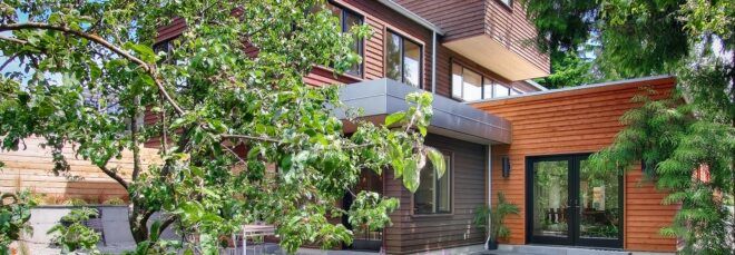 Greenery partially obscuring the view of the home's exterior.