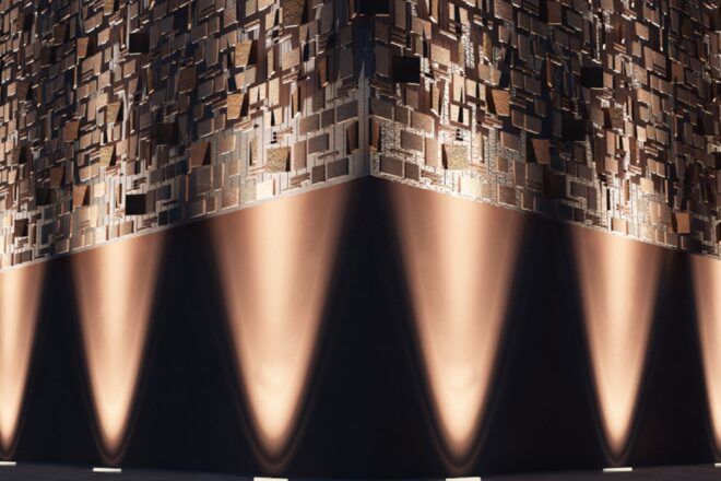 LED lights against a terracotta building