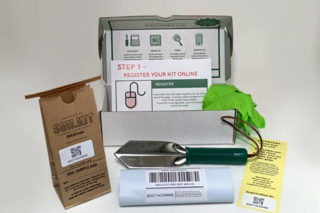 A SoilKit with a brown paper sample bag, trowel and instructions.