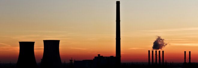 silhouette of coal plant at sunset