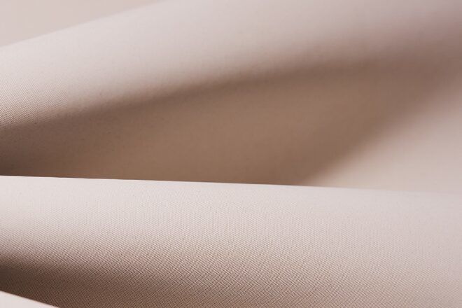 close-up of light pink, plant-based leather
