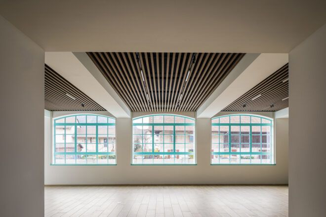 large white room with blue-framed windows