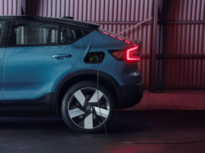 charging cord hanging out of side of electric car