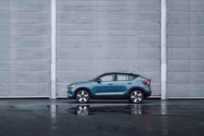 gray electric vehicle near gray wall