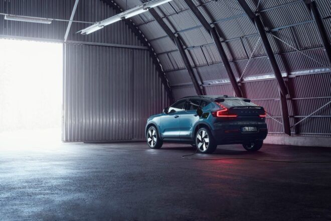 gray electric SUV parked in a garage