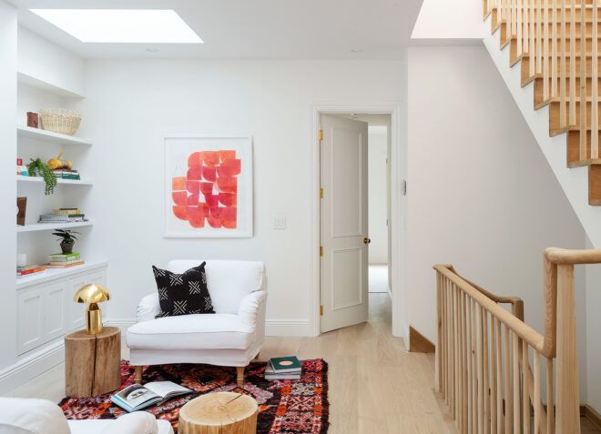 white chair near built-in bookshelves