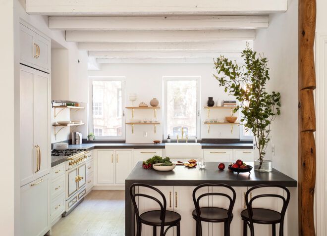 white kitchen with black countertops
