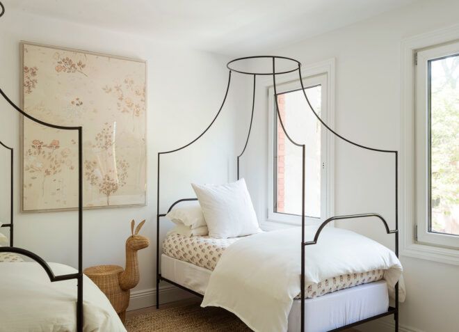two beds with iron frames