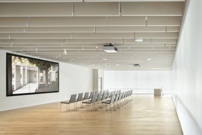 rows of chairs facing a screen