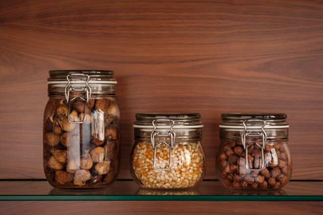 glass jars of nuts and seeds