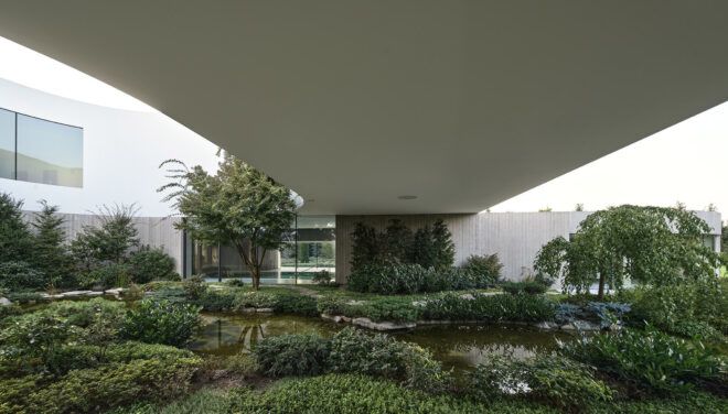 lush garden near white home