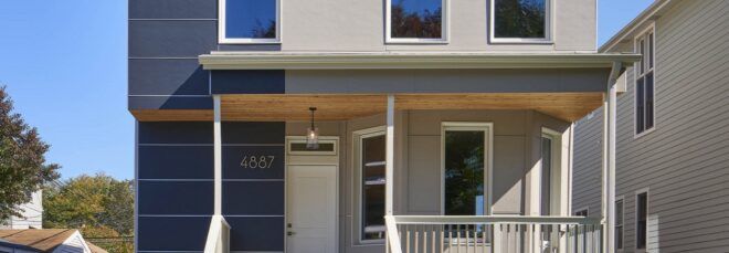 covered front porch on gray passive house
