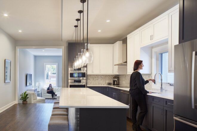 person in gray and white kitchen