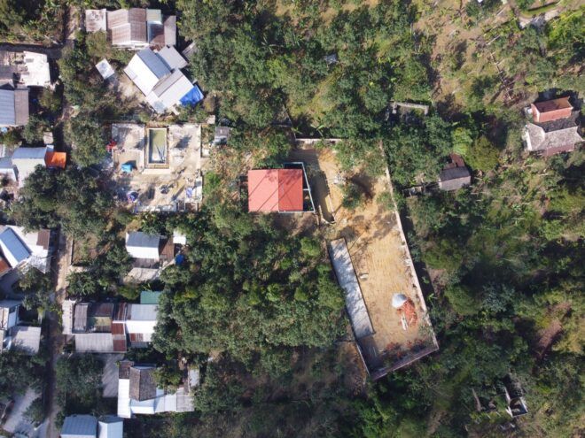 A bird's-eye view of the lush green area where the home is built.