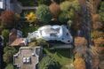 aerial view of large white geometric home