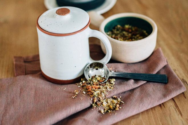 white tea mug and loose-leaf tea