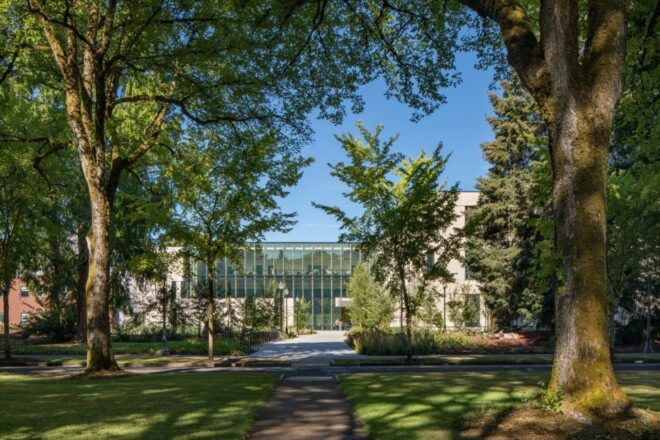 tall trees surrounding campus building