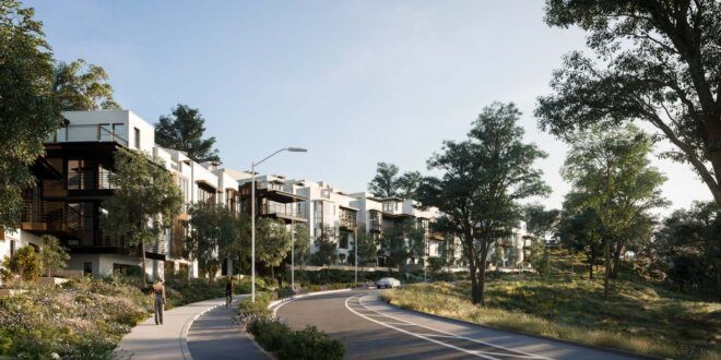 winding road leading to white and gray housing complexes
