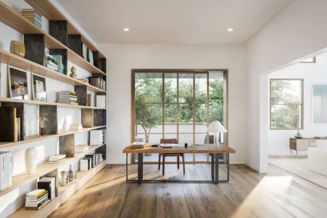 large wood desk near wall of bookshelves