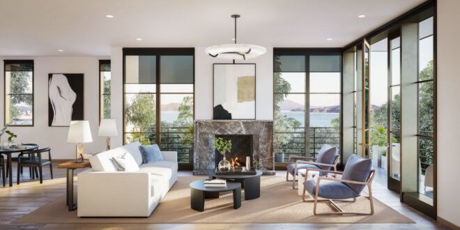 white sofa and blue chairs near fireplace flanked by large windows