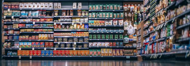 array of products on shelves in grocery store