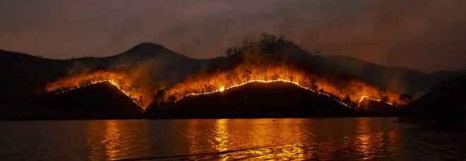 wildfire burning on mountainside