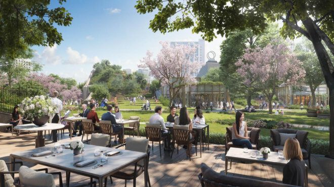 A rendering of an outdoor green space with a patio where people sit at tables.
