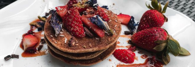 fresh berries on top of vegan pancakes