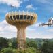 autonomous planes flying around wood landing tower